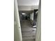 A peek into the kitchen area, showcasing the appliances and lighting, from the entryway at 1457 Richland Sw Rd, Atlanta, GA 30310