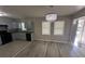 Open concept kitchen features updated appliances and fixtures at 1457 Richland Sw Rd, Atlanta, GA 30310