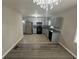 Updated kitchen features modern appliances, granite countertops, and bright grey cabinets at 1457 Richland Sw Rd, Atlanta, GA 30310
