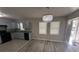Open floor plan with kitchen and dining area, featuring a modern chandelier at 1457 Richland Sw Rd, Atlanta, GA 30310