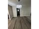 Bright living room with elegant chandelier and wood-look flooring at 1457 Richland Sw Rd, Atlanta, GA 30310