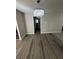 Living room featuring hardwood floors and a modern chandelier, perfect for entertaining or relaxing at 1457 Richland Sw Rd, Atlanta, GA 30310