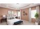 Cozy main bedroom featuring neutral walls, decorative wall art, and comforting carpet at 55 Alameda St # 6, Loganville, GA 30052