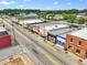 Aerial view of the city street featuring buildings with unique colors and designs at 55 Alameda St # 6, Loganville, GA 30052