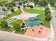 Outdoor park view of an amphitheater with a green lawn, small buildings, and a stage at 55 Alameda St # 6, Loganville, GA 30052