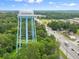 Aerial shot of the city's water tower painted in blue and white with the words 'City of Loganville' at 55 Alameda St # 6, Loganville, GA 30052