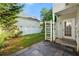 Charming backyard with stone patio, lush green lawn, and white picket fence at 1995 Liberty Hts, Fairburn, GA 30213