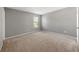 Bedroom with neutral paint and carpet at 1995 Liberty Hts, Fairburn, GA 30213