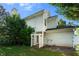 Side of the house showing a well-manicured lawn and access to the backyard at 1995 Liberty Hts, Fairburn, GA 30213