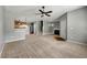 Spacious living room featuring plush carpeting, fireplace, and staircase at 1995 Liberty Hts, Fairburn, GA 30213