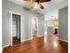 Open concept space with hardwood floors, neutral paint, and view to kitchen at 1995 Liberty Hts, Fairburn, GA 30213