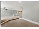 Open-concept living room with seamless transition to kitchen and hardwood floors at 1995 Liberty Hts, Fairburn, GA 30213