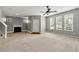 Bright and airy living room featuring a fireplace and large windows at 1995 Liberty Hts, Fairburn, GA 30213