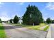 Street view showcases well-maintained lawns and mature trees at 1995 Liberty Hts, Fairburn, GA 30213