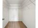 Spacious walk-in closet with wire shelving and carpeting at 1995 Liberty Hts, Fairburn, GA 30213