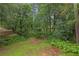 Lush, expansive backyard with mature trees providing shade and privacy at 3510 Dunn Se St, Smyrna, GA 30080
