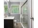 Updated bathroom featuring a glass enclosed shower and modern vanity at 3510 Dunn Se St, Smyrna, GA 30080