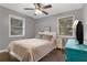 Cozy bedroom featuring hardwood floors, neutral walls, and ceiling fan at 3510 Dunn Se St, Smyrna, GA 30080