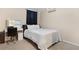 Cozy bedroom featuring neutral walls, carpet, and dark window coverings at 3510 Dunn Se St, Smyrna, GA 30080