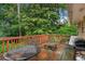 Inviting outdoor deck, perfect for entertaining amidst lush greenery and mature trees at 3510 Dunn Se St, Smyrna, GA 30080