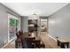 Dining room featuring a dark wood table with seamless access to the kitchen and other areas of the home at 3510 Dunn Se St, Smyrna, GA 30080