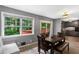 Bright dining area features a dark wood table, ample natural light, and access to both the kitchen and outdoor deck at 3510 Dunn Se St, Smyrna, GA 30080
