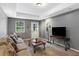 Relaxing living room featuring carpet, a TV, and a comfortable couch at 3510 Dunn Se St, Smyrna, GA 30080