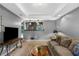 Cozy living room featuring carpet, a large TV, and a comfortable couch at 3510 Dunn Se St, Smyrna, GA 30080