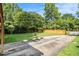 A spacious backyard features a wooden fence, a picnic table, and a green lawn at 961 Lindbergh Ne Dr, Atlanta, GA 30324