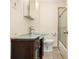Modern bathroom with glass countertop sink, vanity and tiled walk-in shower at 961 Lindbergh Ne Dr, Atlanta, GA 30324