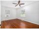 Bright bedroom with hardwood floors, ceiling fan, and two windows at 961 Lindbergh Ne Dr, Atlanta, GA 30324