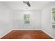 Sunlit bedroom features hardwood floors and plenty of natural light from the window at 961 Lindbergh Ne Dr, Atlanta, GA 30324