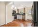 A well-lit kitchen with stainless appliances, white cabinets, and hardwood floors at 961 Lindbergh Ne Dr, Atlanta, GA 30324