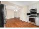 Kitchen featuring stainless appliances, white cabinets and hardwood flooring at 961 Lindbergh Ne Dr, Atlanta, GA 30324