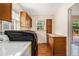 Laundry room with wood cabinets, wood paneled walls and wood floors at 961 Lindbergh Ne Dr, Atlanta, GA 30324
