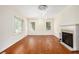 Bright living room with hardwood floors, fireplace, and modern chandelier at 961 Lindbergh Ne Dr, Atlanta, GA 30324