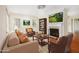 Cozy living room with fireplace, hardwood floors, and ample natural light at 961 Lindbergh Ne Dr, Atlanta, GA 30324