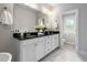 Elegant bathroom with dual vanities, granite countertops, and modern fixtures at 209 Snapdragon St, Woodstock, GA 30188