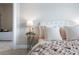 Bright bedroom featuring a bed with white pillows and a chunky knit throw at 209 Snapdragon St, Woodstock, GA 30188