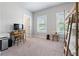 Bedroom showcases bunk beds, large windows, and desk, creating a versatile space at 209 Snapdragon St, Woodstock, GA 30188