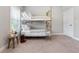 Charming bedroom featuring a metal bunk bed, neutral carpet, and a sunny window at 209 Snapdragon St, Woodstock, GA 30188