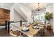 Dining area showcasing an open floor plan with stairs, kitchen view, and natural light at 209 Snapdragon St, Woodstock, GA 30188