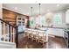 Spacious kitchen boasting an island, wooden accent wall, and stylish pendant lighting at 209 Snapdragon St, Woodstock, GA 30188