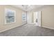 A cozy bedroom with neutral walls, plush carpet, and a bathroom en suite at 250 Kensington Trce, Stockbridge, GA 30281