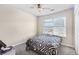 This bedroom includes a ceiling fan, and a window with natural light at 250 Kensington Trce, Stockbridge, GA 30281