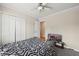 This bedroom includes a ceiling fan, access to another room and has a large closet at 250 Kensington Trce, Stockbridge, GA 30281