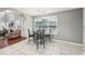 Bright dining area features tile floor, large window, and an elegant chandelier lighting the table at 250 Kensington Trce, Stockbridge, GA 30281
