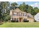 Charming two-story home featuring a well-manicured lawn and a two-car garage with traditional curb appeal at 250 Kensington Trce, Stockbridge, GA 30281