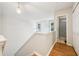 Hallway at top of stairs, with adjacent bathroom and closets at 250 Kensington Trce, Stockbridge, GA 30281