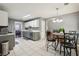 Bright, open kitchen with gray cabinets, stainless steel appliances, and eat-in area at 250 Kensington Trce, Stockbridge, GA 30281